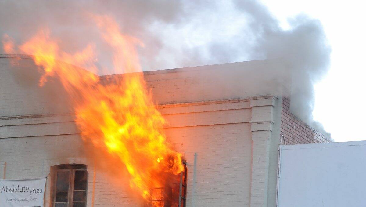 Flames spill out of the yoga studio. PICTURE: LACHLAN BENCE