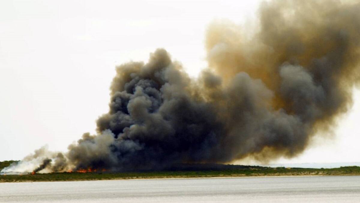 A fire burning at Port Boston near Port Lincoln, South Australia has been contained but firefighters are on standby.