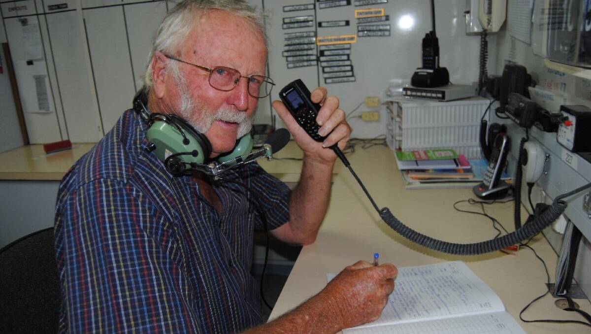 As the State's heatwave continues, Naracoorte CFS stalwart Joe Hole waits anxiously for a call-out in the telecommunications room at the local station.