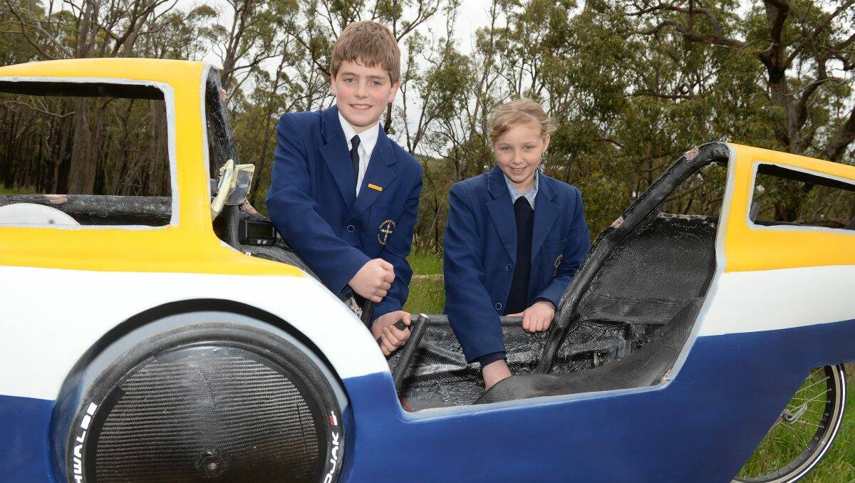 HOT WHEELS: Damascus College energy breakthrough team members Jonathan Western,13 and Bec McColl, 13, prepare for the RACV Energy Breakthrough challenge in Maryborough, which starts tomorrow. PICTURE: KATE HEALY  