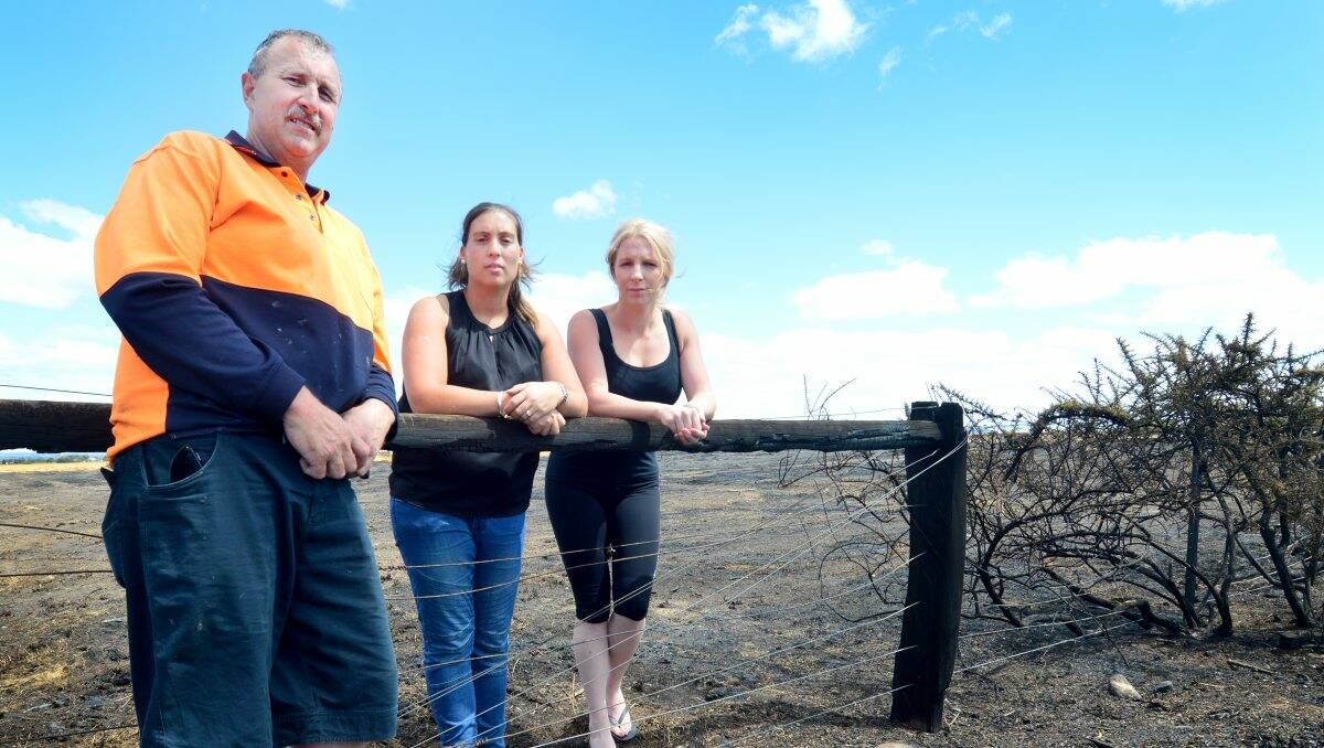 HELPING HANDS: Greg Quayle, Kelly Kosloff and Samara Shimmin survey the burnt area. PICTURE: DYLAN BURNS