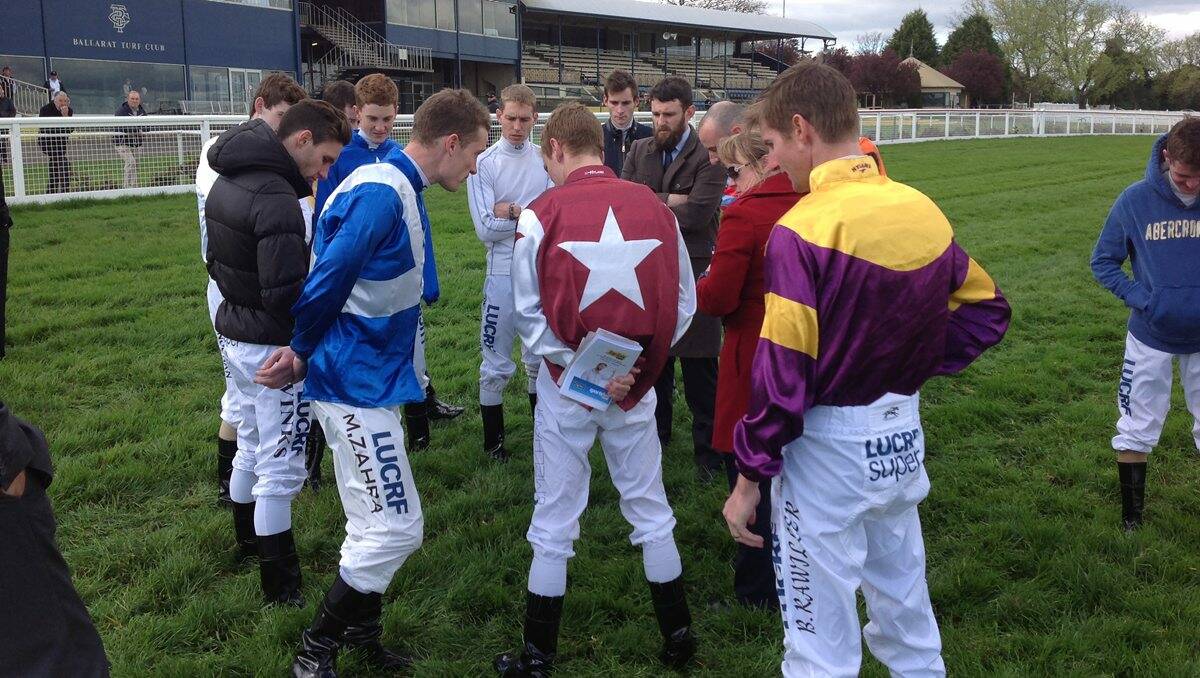 UNHAPPY: Head steward Corey Waller speaks with jockeys during a track inspection shortly before yesterday’s Ballarat race meeting was abandoned.