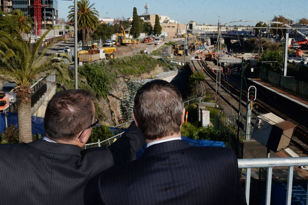 Regional Rail Link Authority CEO Corey Hannett and Premier Denis Napthine overlook work on the Regional Rail Project. 