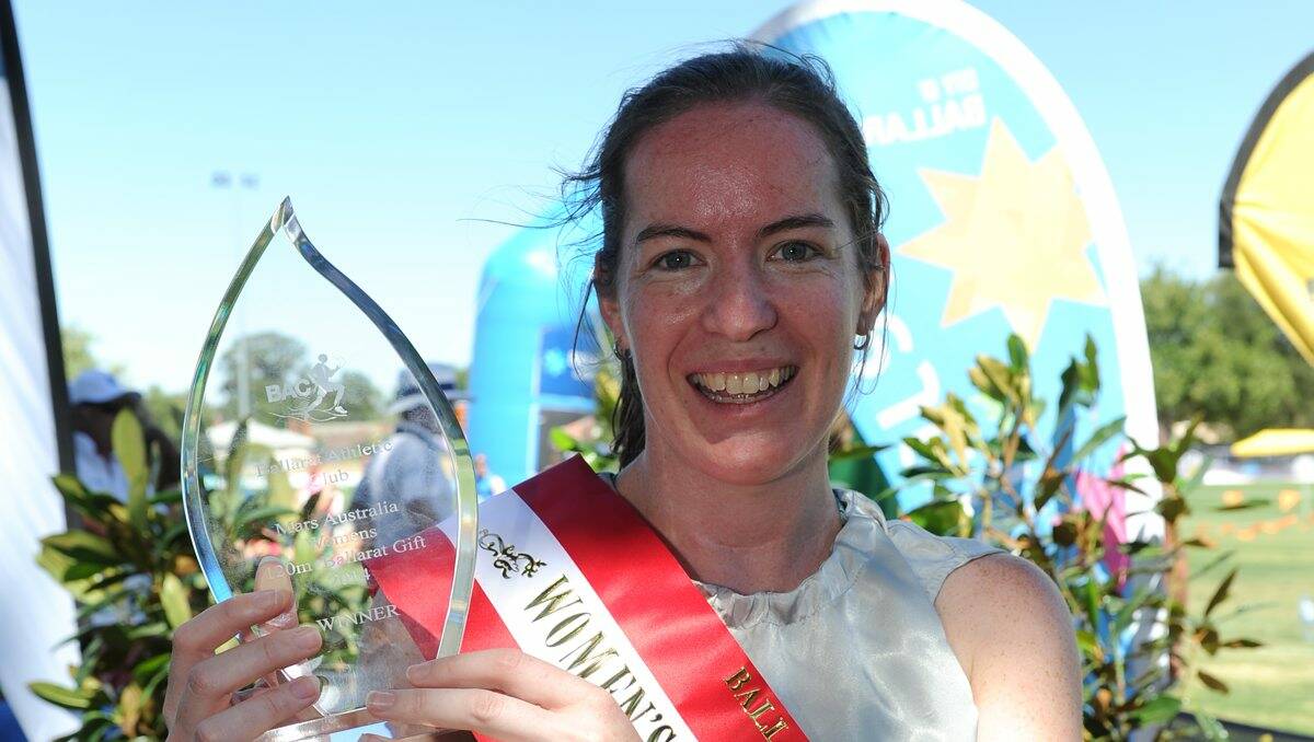 Celia Cosgriff proudly displays her trophy after winning the Ballarat Women’s Gift. 