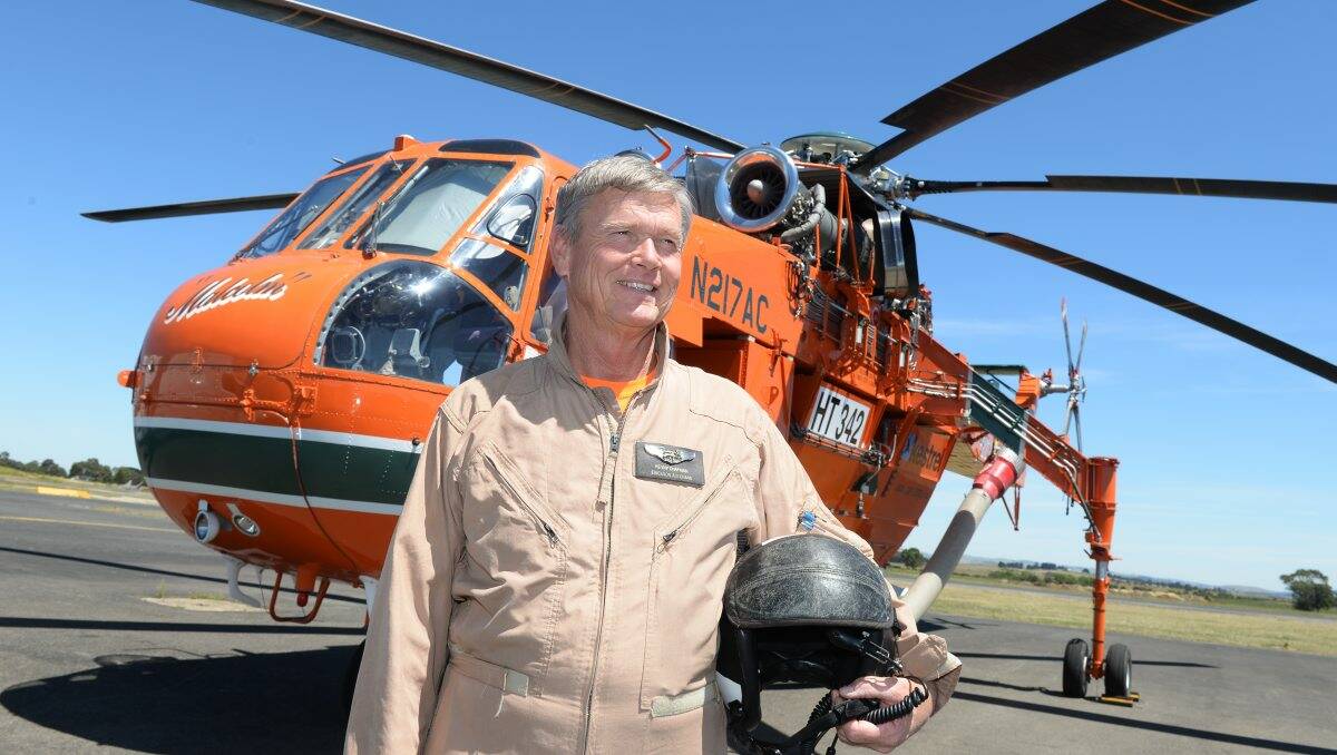 HELP IS HERE: Pilot Kenny Chapman prepares “Malcolm”, the Erickson Aircrane, for duty at Ballarat Airport yesterday.  PICTURE: KATE HEALY