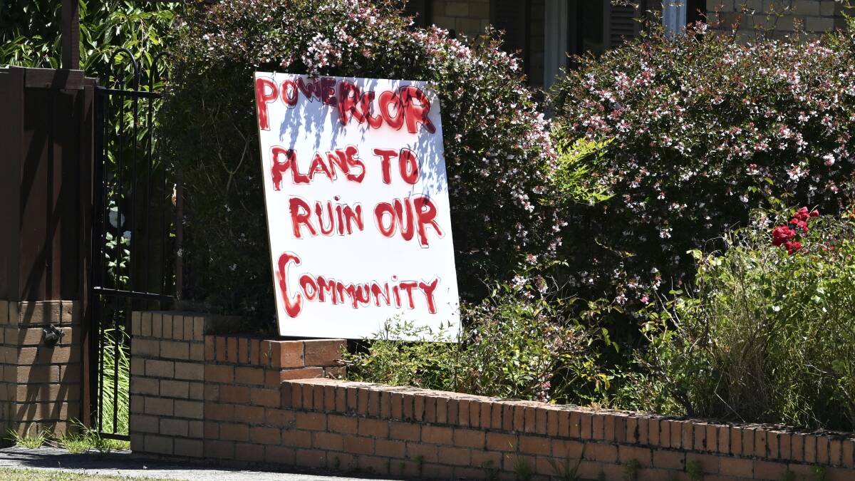 Signs against the substation now sit on residents properties. Picture by Lachlan Bence