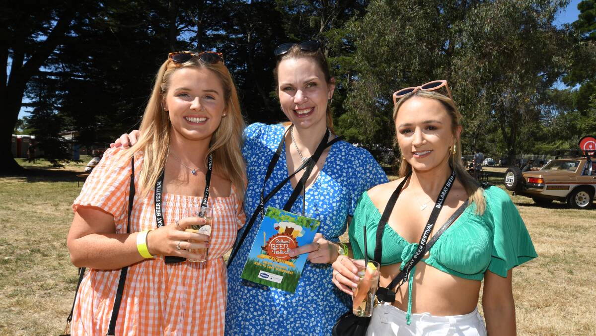Erin Linnane (left), Kate Bowe and Elle Marsh out in the sun. Picture by Kate Healy