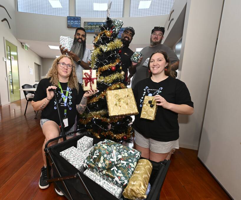 Daen Haby, Shu Brown, Aaron Clarke, Casey Bandy, Nikki Bell pose under the Christmas tree for the 2023 Ballarat Toy Run. Picture by Lachlan Bence 