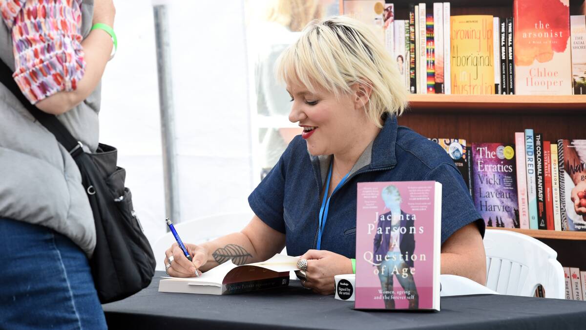 Jacinta Parsons signing her book 'A Question of Age'. Picture by Kate Healy