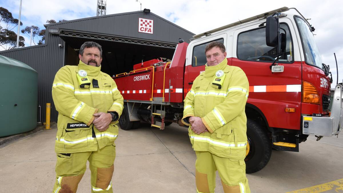 Creswick CFA's 1st Lieutenant Geoff Hepworth (left) and Captain Steven Ellis thanked the community for their support after a command vehicle was stolen from the station. Picture by Lachlan Bence