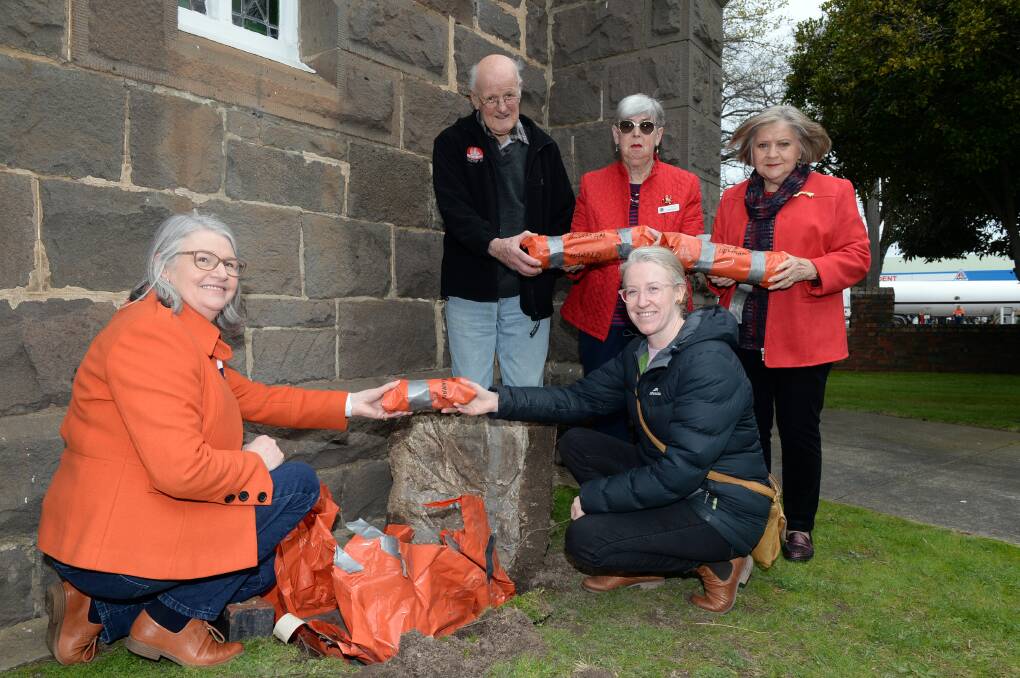 Cheryl Kennedy(left) , Max Smith, Zelma Toplis, Nicole Loader and Sandra Ballard open a time capsule at Skipton Street Uniting Church. Picture by Kate Healy
