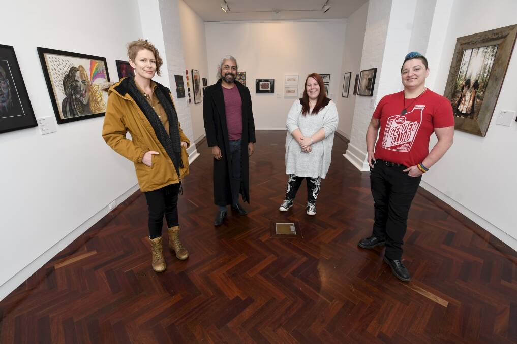 ON SHOW: Frolic Dark Rainbow arts and literature director Sarah Hart with artists Daniel Lamech, Yasmin Mata, Cory Bartlett. Picture: Lachlan Bence