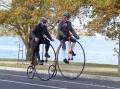 ON YOUR BIKE: Two cyclists riding around Lake Wendouree as part of the Heritage Festival's Tweed Ride event.