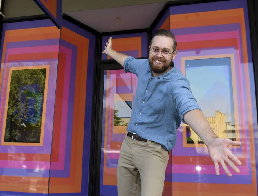 VIBRANT: Artist Spencer Harrison in front of his Sturt Street art installation. Picture: Lachlan Bence