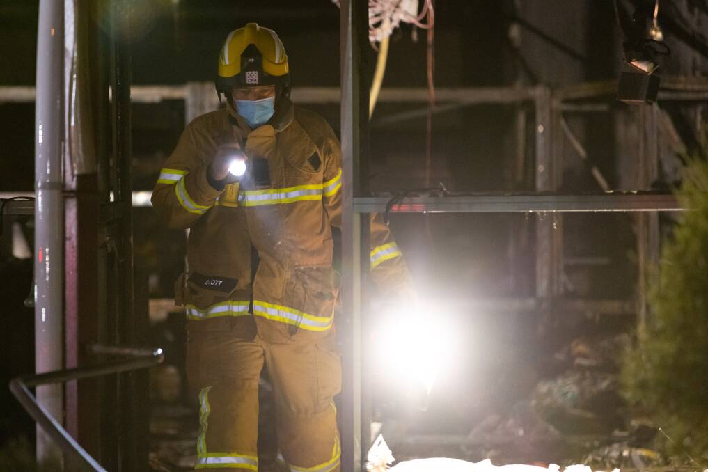 A firefighter assesses the damage. Picture: Uniform Photography
