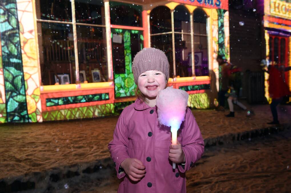WELL LIT: Ella Conder, 6, enjoys the opening night of Winter Wonderlights. Pictures: Kate Healy