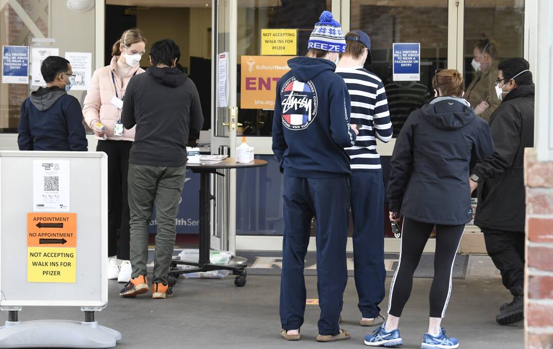 STILL MOVING: Ballarat residents outside the vaccination hub at the Mercure. Picture: Lachlan Bence