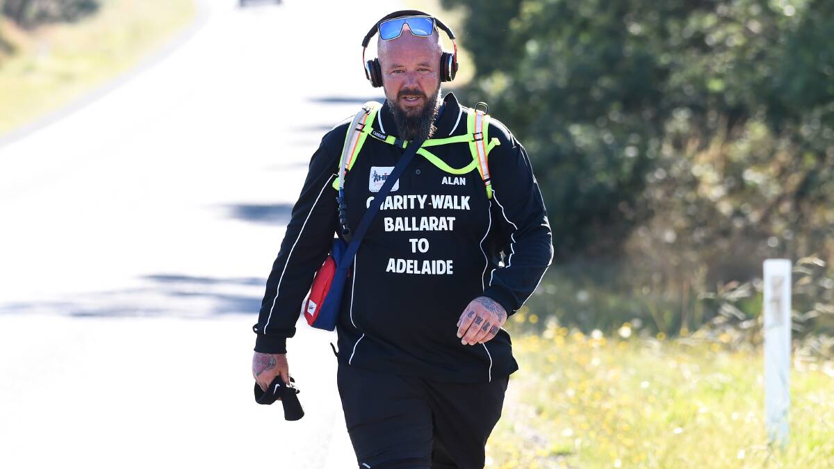 DETERMINED: Mr Thorpe during the first leg of his walk along Ballarat-Carngham Road on Saturday morning.