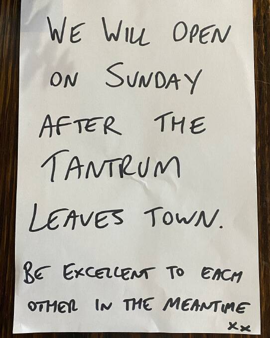 The sign left on the door of Midtown Cellars and Bar ahead of Sunday's protests.