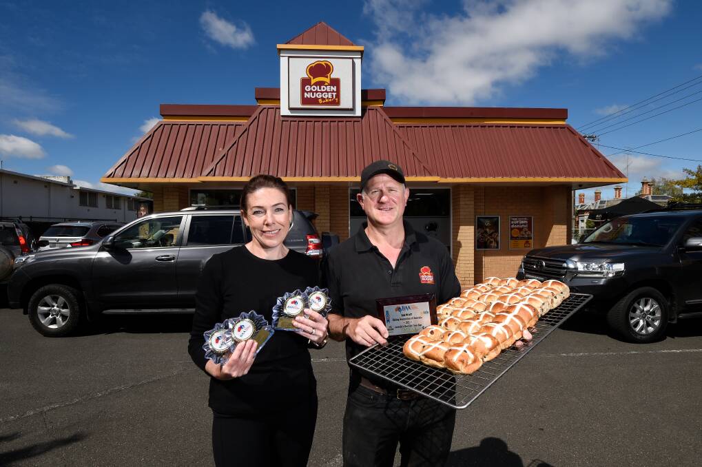Golden Nugget Bakery owners Alicia and Wal Matthews with their award-winning hot cross buns. Pictures: Adam Trafford