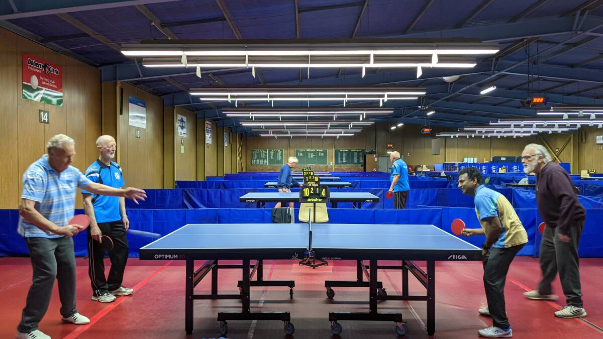 Ballarat Table Tennis Association members play under the stadium's lights.