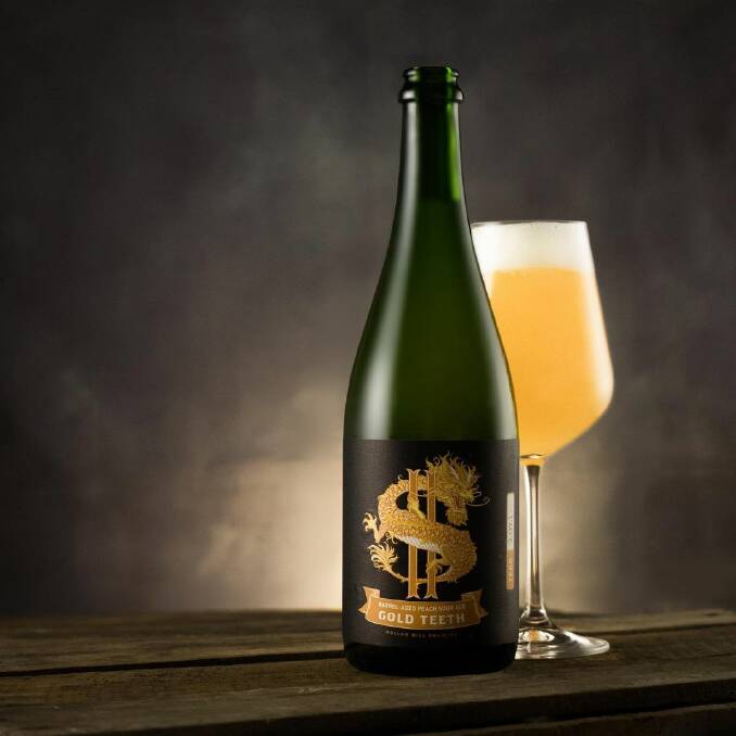 CHEERS: Dollar Bill Brewing's award-winning Gold Teeth barrel-aged peach sour ale. Picture: supplied