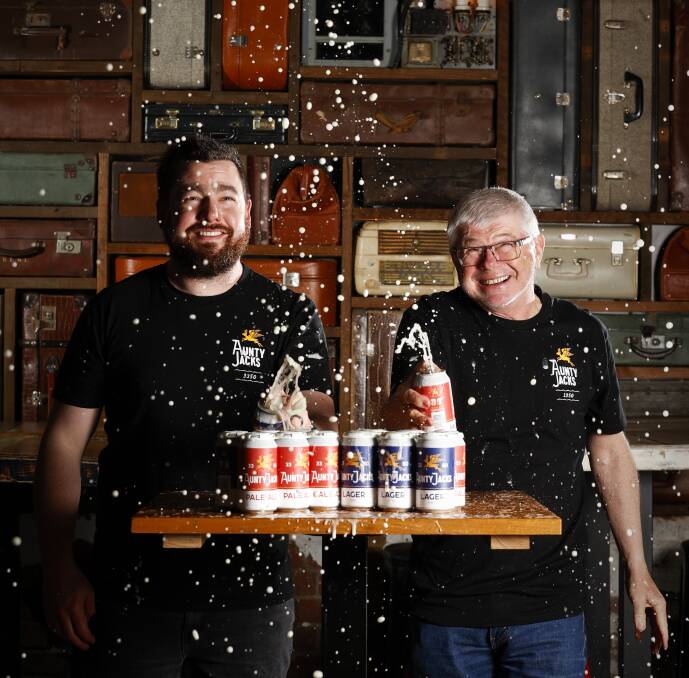 CHEERS: Matt Ives and Peter Aldred of Aunty Jacks brewery with the new canned beers. Picture: Luke Hemer