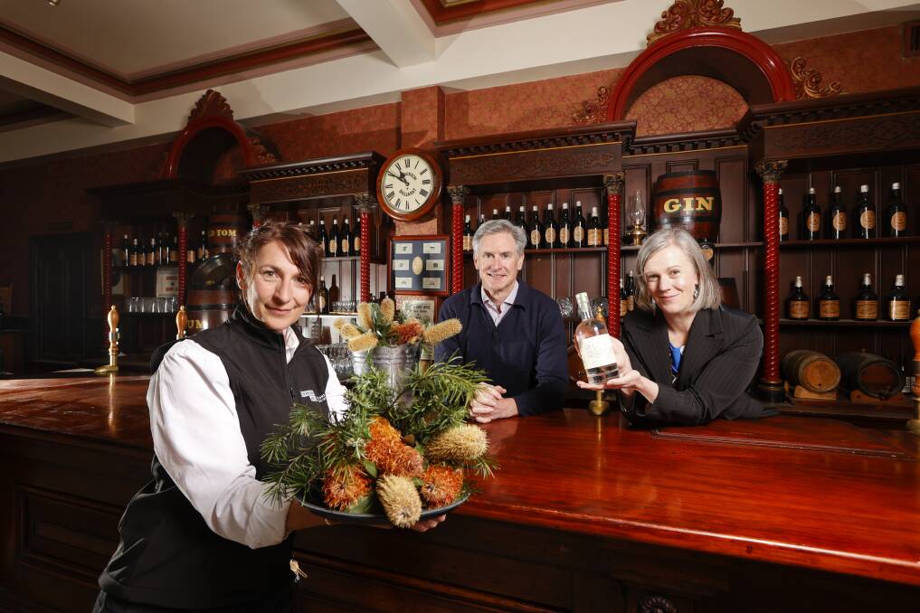 CHEERS: Sovereign Hill gardens and landscape manager Cherrie Neale, chief development officer Will Flamsteed and CEO Sara Quon with the new Sly Grog gin and the botanicals used for it. Picture: Luke Hemer