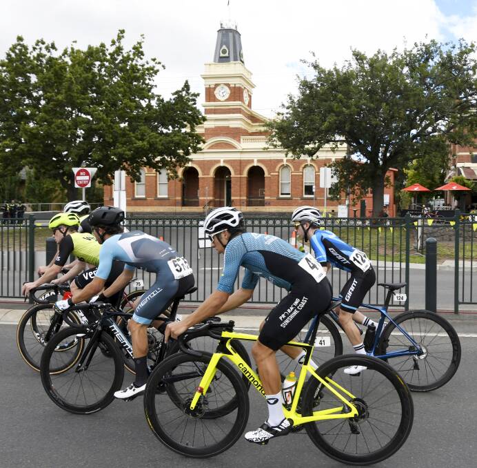 HIT THE TOWN: Cyclists ride past Buninyong Town Hall. Picture: Lachlan Bence