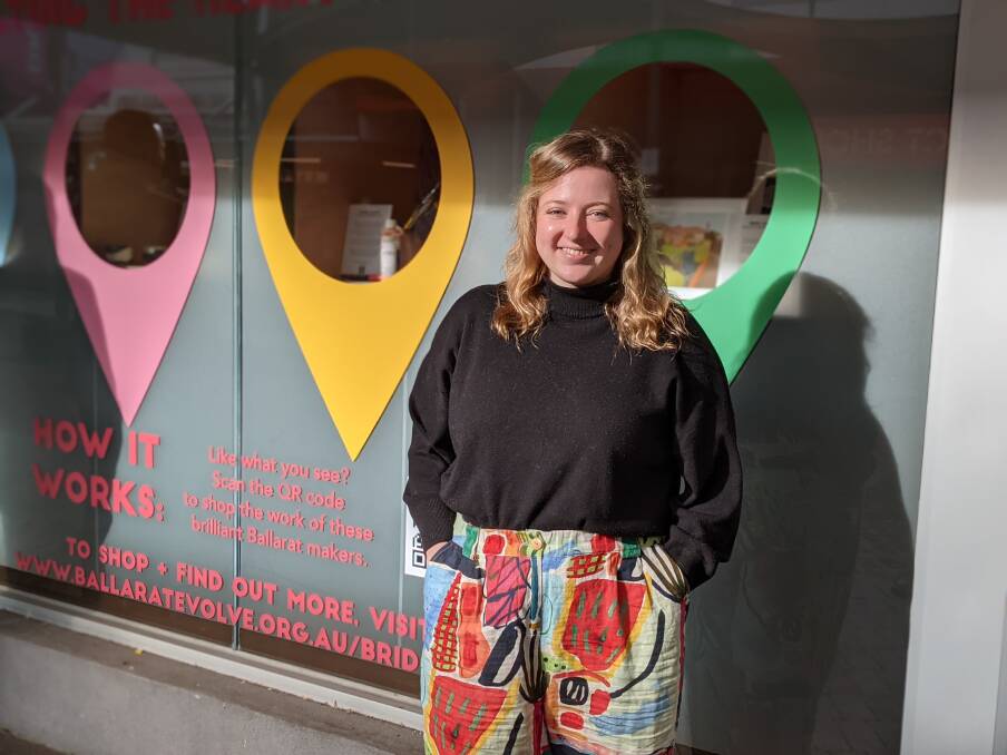 ON SHOW: Ballarat Evolve project officer Kelsie White outside one of the project's shopfront.
