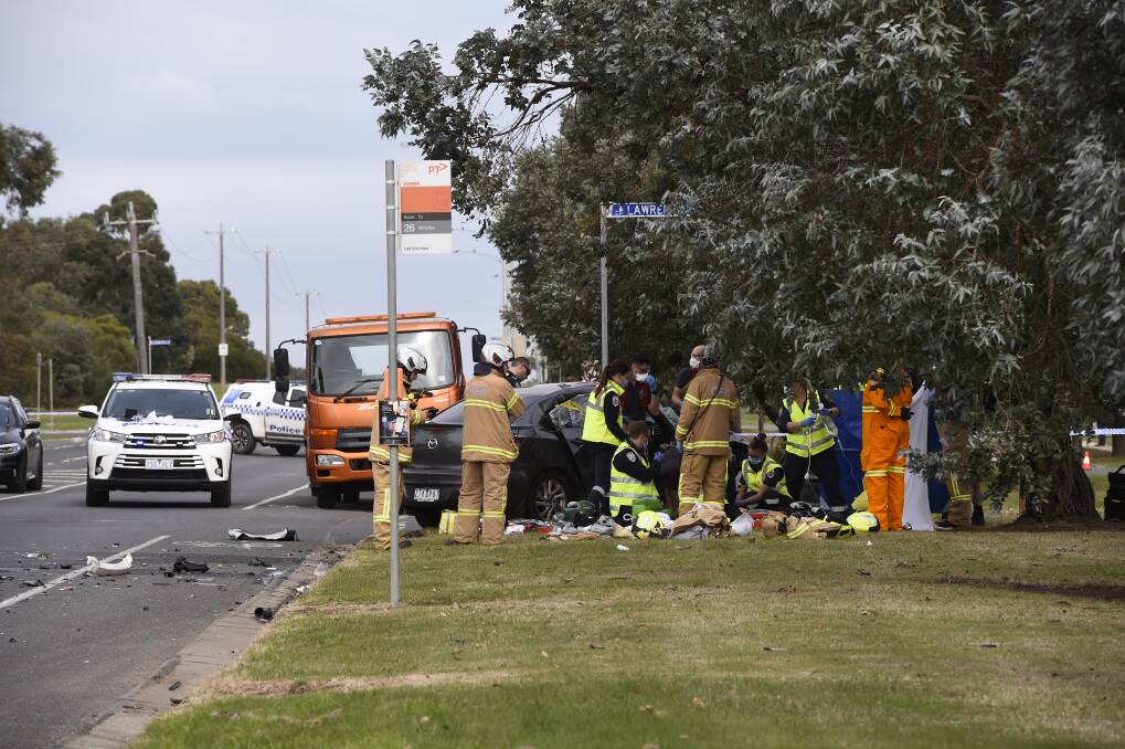 CRASH: Emergency services crews attend to the accident scene at Learmonth Street in Alfredton. Picture: Adam Trafford