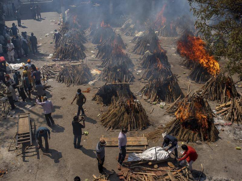 TRAGEDY: A collection of makeshift funeral pyres to cremate bodies of those that have died from COVID-19. Picture: AAP