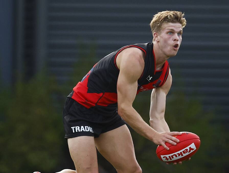 Ben Hobbs look to move the ball on during Essendon's practice match against the Western Bulldogs. Picture: Daniel Pockett/Getty Images