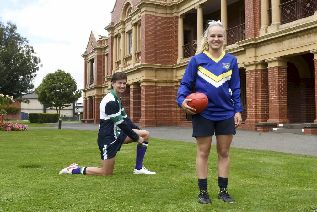 Butler in his St Patrick's jumper alongside fellow Rebel Lilli Condon. Picture: Lachlan Bence