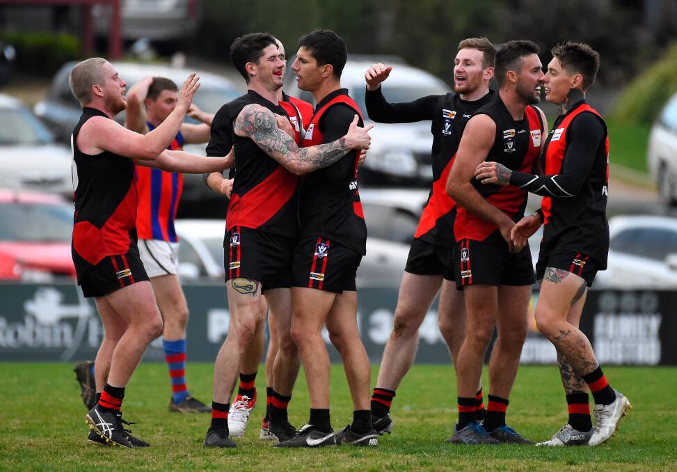 Buninyong players celebrate a goal in its round eight clash with Hepburn in 2019. Picture: Adam Trafford