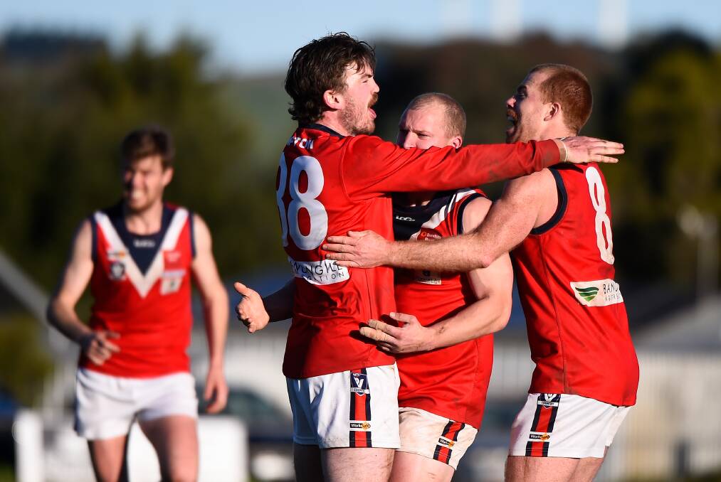 Gilbert (right) celebrates with teammates after a goal against Waubra. Picture: Adam Trafford