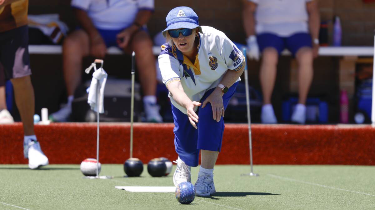 Lynette Lock of Midlands guides a bowl down the green on Tuesday. Picture: Luke Hemer