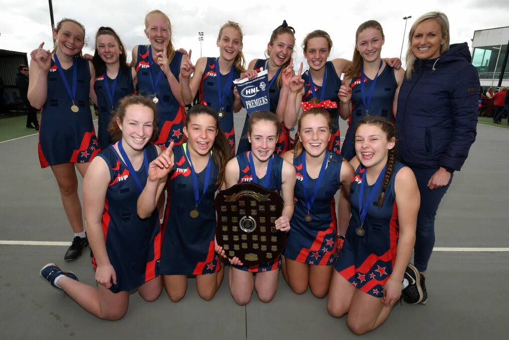 Clarke (back row, far right) with one of her two premiership sides in 2017. Picture: Kate Healy