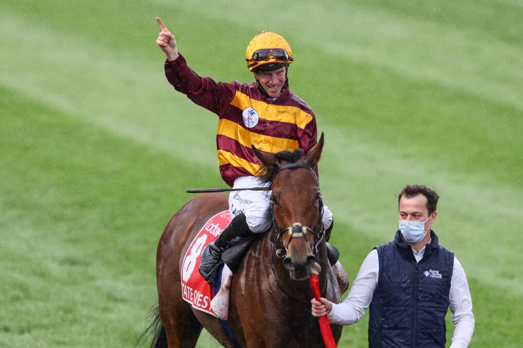 John Allen salutes after winning the Cox Plate riding State of Rest. Picture: George Sal/Racing Photos