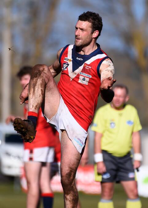 Andrew Pitson kicks for goal against Springbank. Picture: Adam Trafford