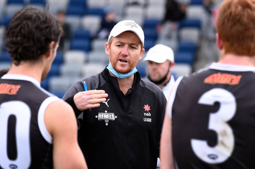 Jason Lappin gives the GWV Rebels boys some instructions during
their clash against Gippsland Power this season. Picture: Adam Trafford