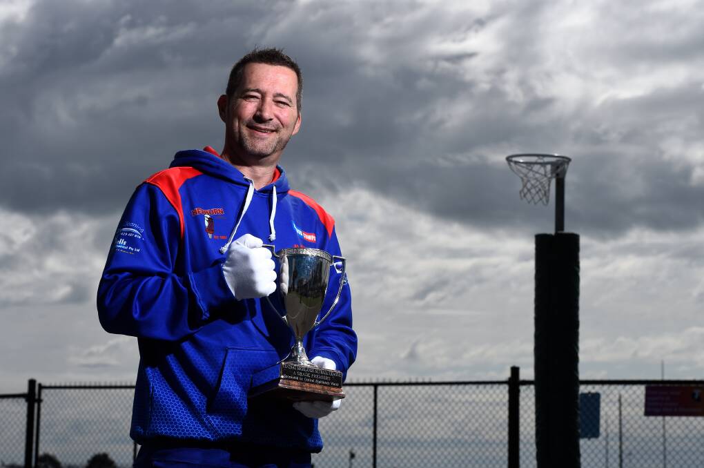 Gary Cooke with the 2019 premiership cup, which his side would win just a few days later. Picture: Adam Trafford