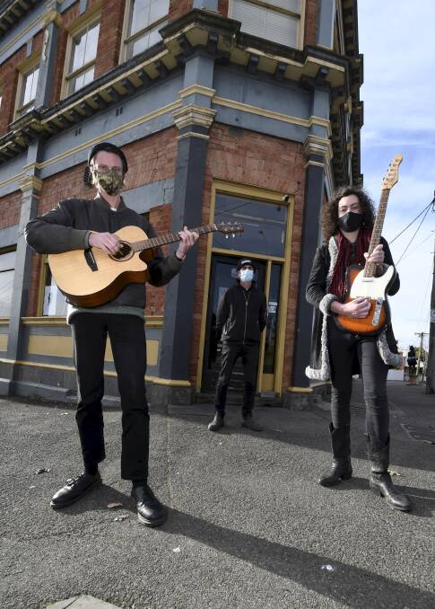 STILL STRUGGLING: Musicians Stanley Woodhouse, Oscar Hauke and The Eastern Hotel owner Matt Stone say the restrictions easing won't fix their industry. Picture: Lachlan Bence