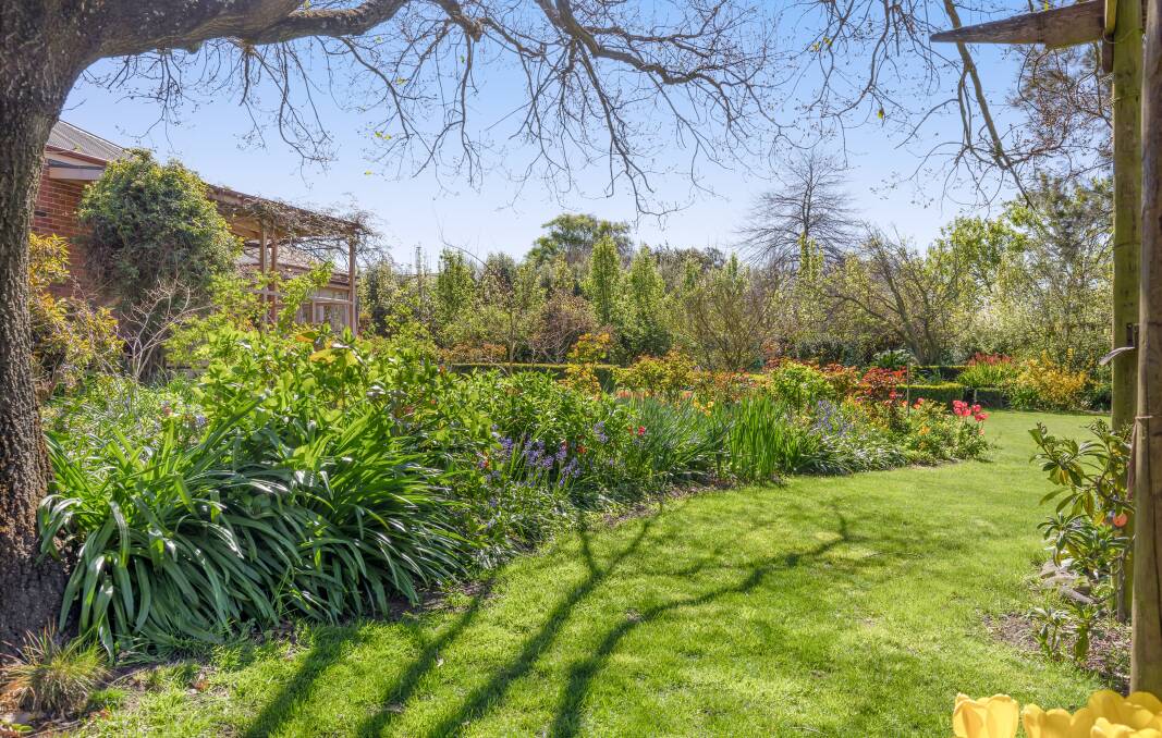 SPECIAL SPACE: The property includes a garden with hundreds of tulips and bluebells. Picture: Supplied.