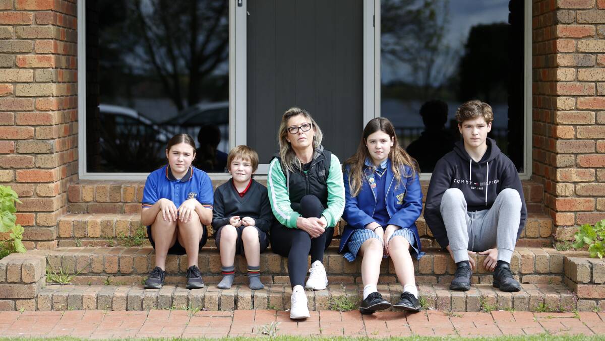 IMPACTED: Julie Gayton (centre) with her children Stephanie, William, Charlotte, and Lachlan. Picture: Luke Hemer.