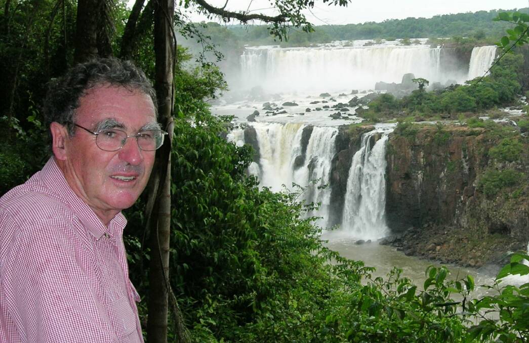Geoffrey Williams at Victoria Falls, Zimbabwe, on one of his journeys as travel editor with The Advertiser in Adelaide. Picture: Supplied.

