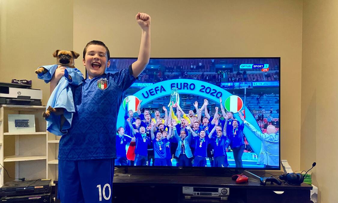 FORZA ITALIA: Angus Farrell celebrates Italy's win with his dog Rigby. PHOTO: Olivia Condous 