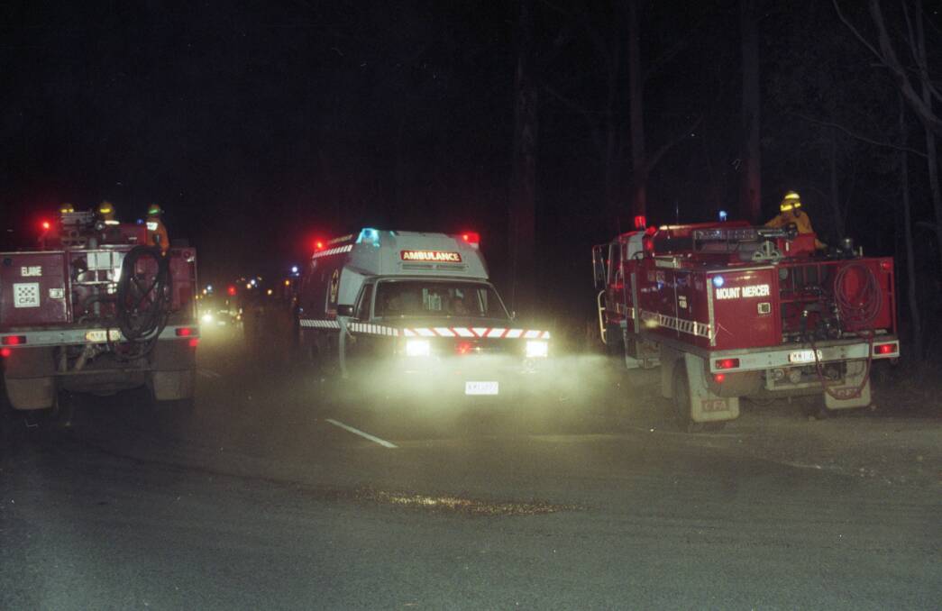 An ambulance at the fire ground after five Geelong West firefighters died on Wednesday, December 2, 1998. Picture by Lachlan Bence