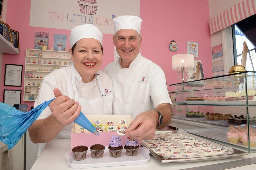 Madeleine and Mark Witham from The Little Cupcake Ballarat, prepping a variety of coronation-themed cupcakes. Pictures by Kate Healy. 