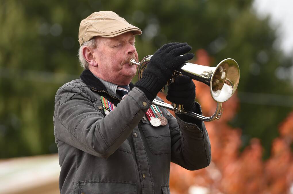 Dennis Hawkes playing The Last Post in 2023. Picture by Adam Trafford